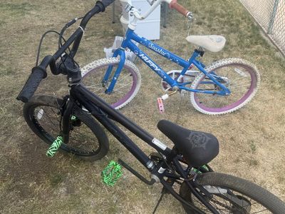 Two Bicycles - Huffy Seastar and Black BMX Style