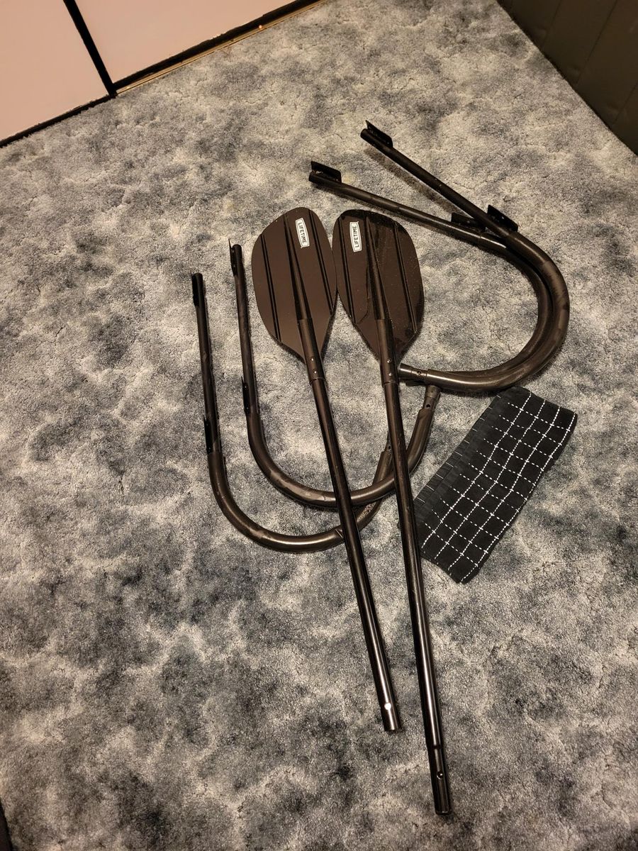 Kayak wall hangers and paddle