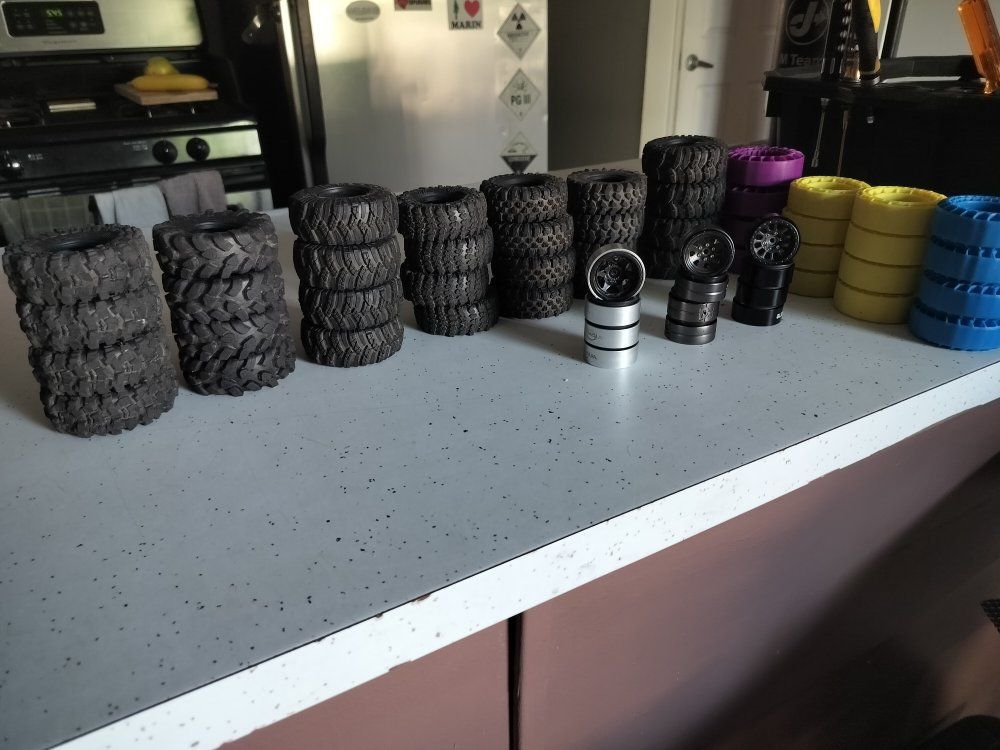 7 Sets of 1.3 rc crawler tires, 3 sets of 1.3 wheels, 4 sets of silicone tire inserts