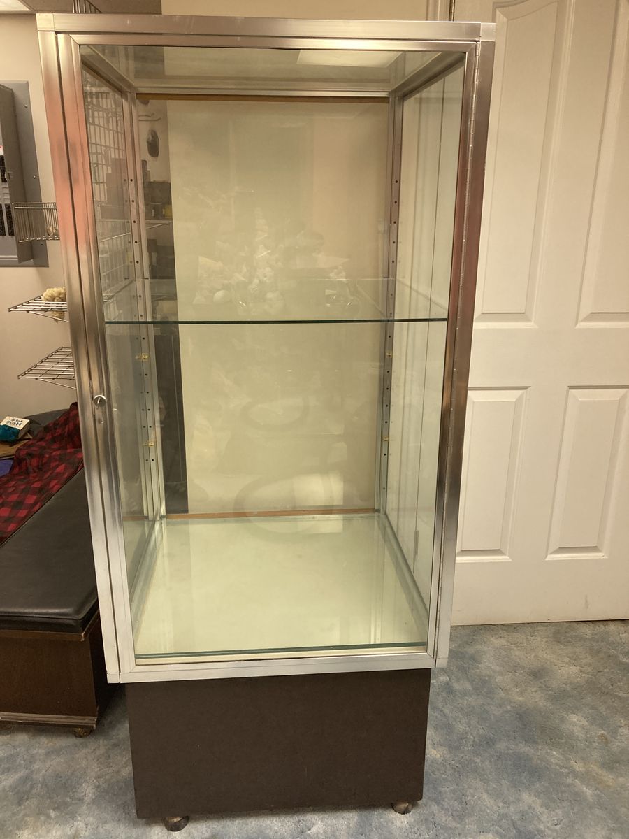 Tower Display Case Silver Aluminum Frame Tempered Glass Panels Lock & Key Dark Wood Base & Wheels