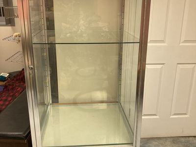 Tower Display Case Silver Aluminum Frame Tempered Glass Panels Lock & Key Dark Wood Base & Wheels