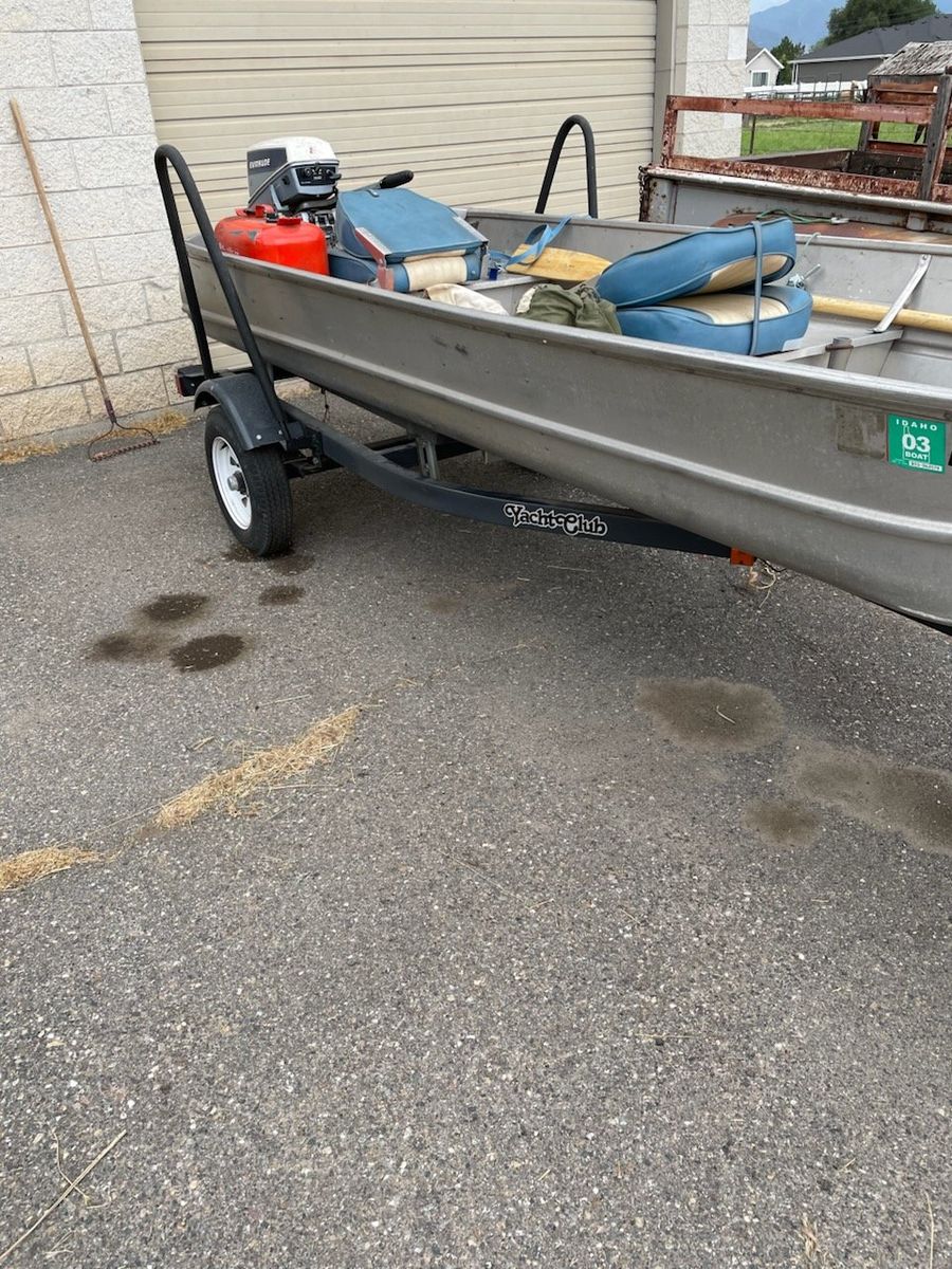 Aluminum fishing boat with motor and trailer