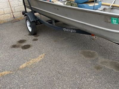 Aluminum fishing boat with motor and trailer