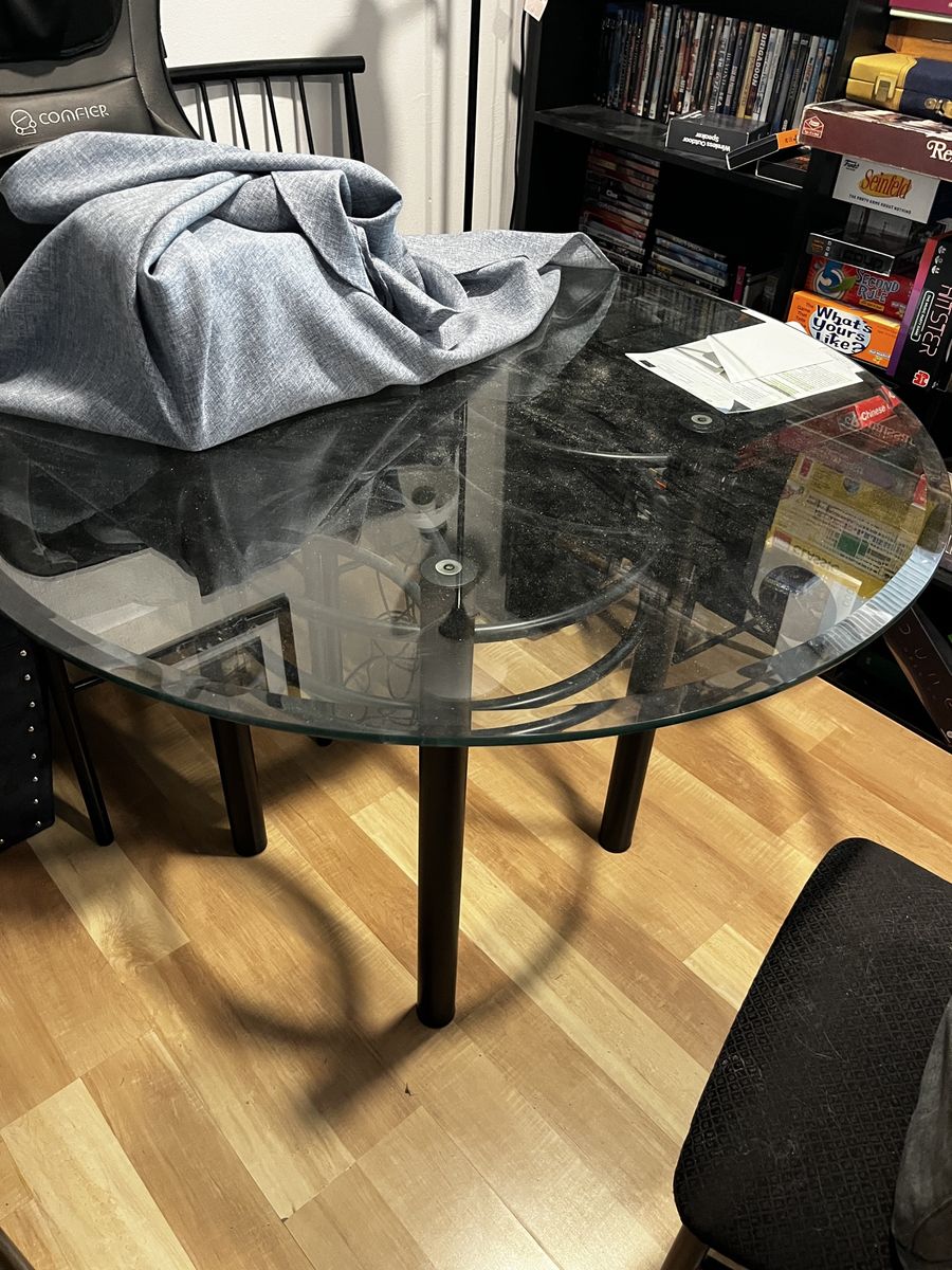 Round Glass Dining Table with Black Metal Legs and 4 chairs