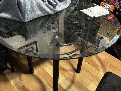 Round Glass Dining Table with Black Metal Legs and 4 chairs