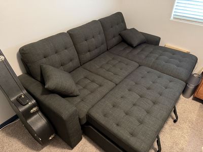 Spacious Grey Sectional Sofa with Pull-Out Bed and Storage Chaise - Perfect for Living Room