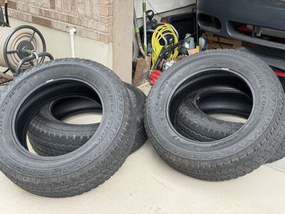 Bridgestone Dueler A/T LT275/65R20 126/123R LRE All-Terrain Truck Tires (Set of 4)
