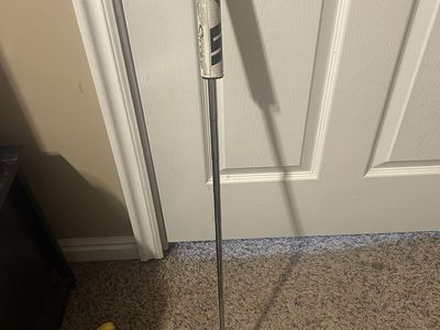 Blade Wilson putter with happy Gilmore cover