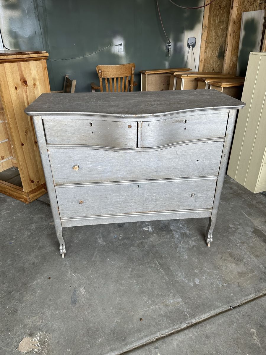 Antique Serpentine Front Dresser with Carved Legs and Casters