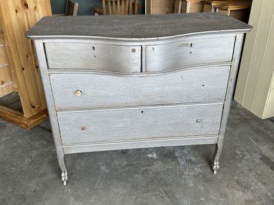 Antique Serpentine Front Dresser with Carved Legs and Casters
