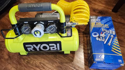 New portable Ryobi 18V air compressor with an accessory pack included.