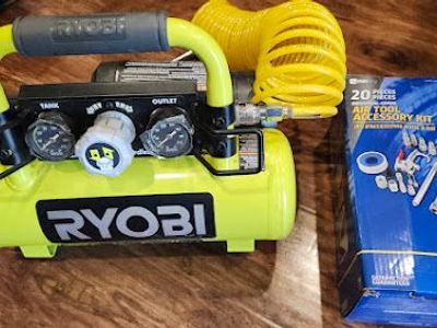 New portable Ryobi 18V air compressor with an accessory pack included.