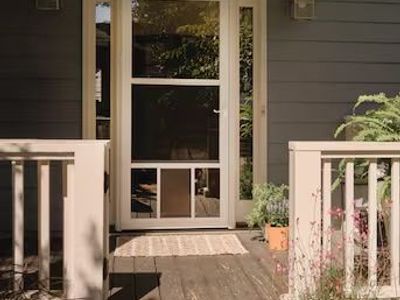 Larson pet full view, aluminum reversible, hinge, storm door with self storing screen, brand new