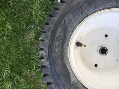 Riding lawn mower, back wheels.