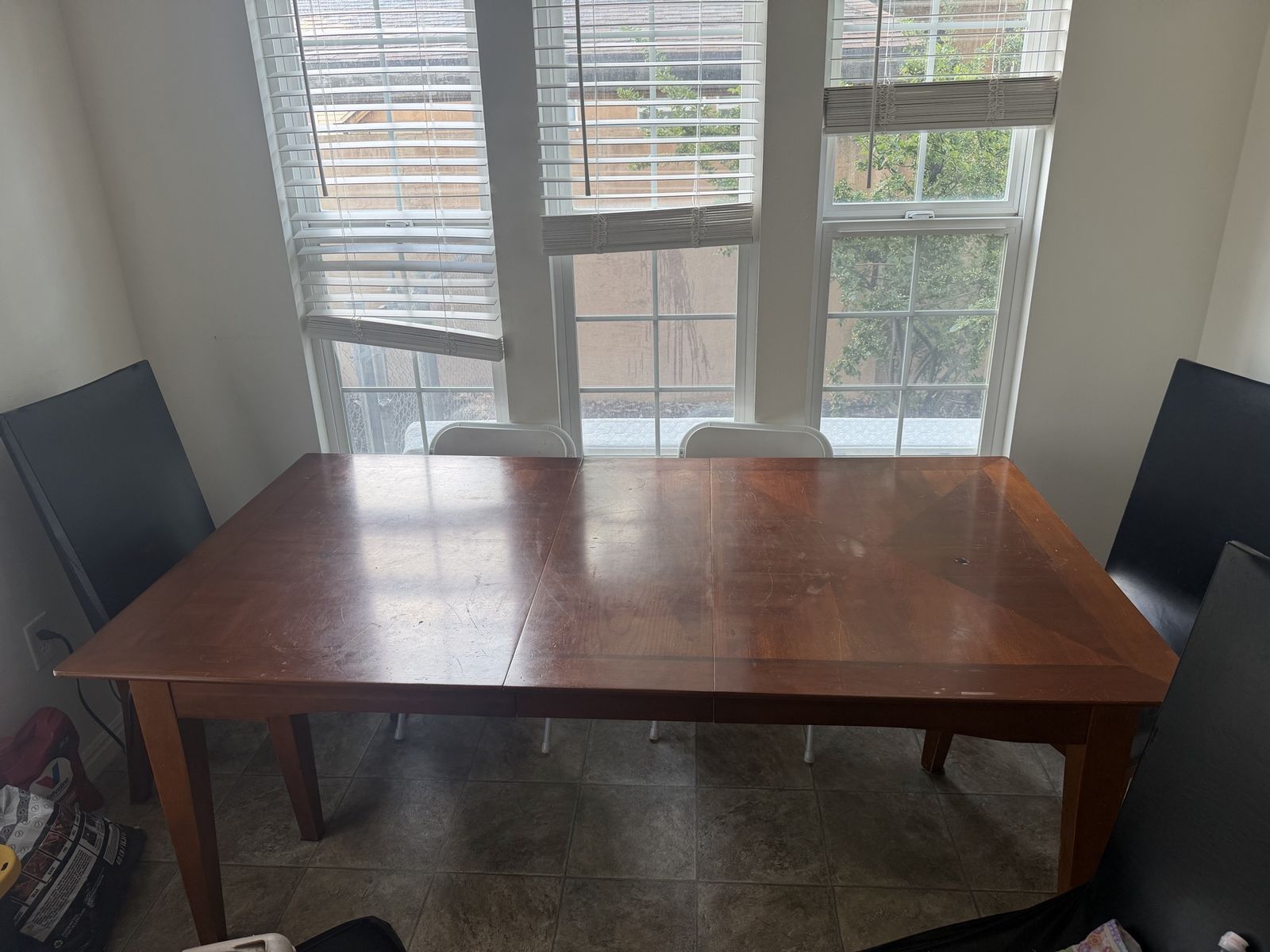 Table with leaf and 6 chairs with covers