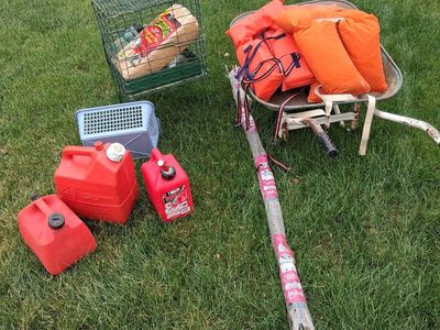 wheelbarrow, plant stakes, gas cans