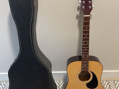 Hondo Guitar with hard carrying case