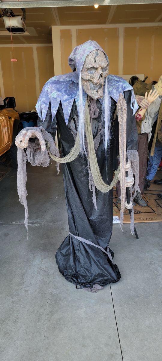Life-Size Animated Reaper Halloween Prop with Light-Up Eyes, Sound, and Motion