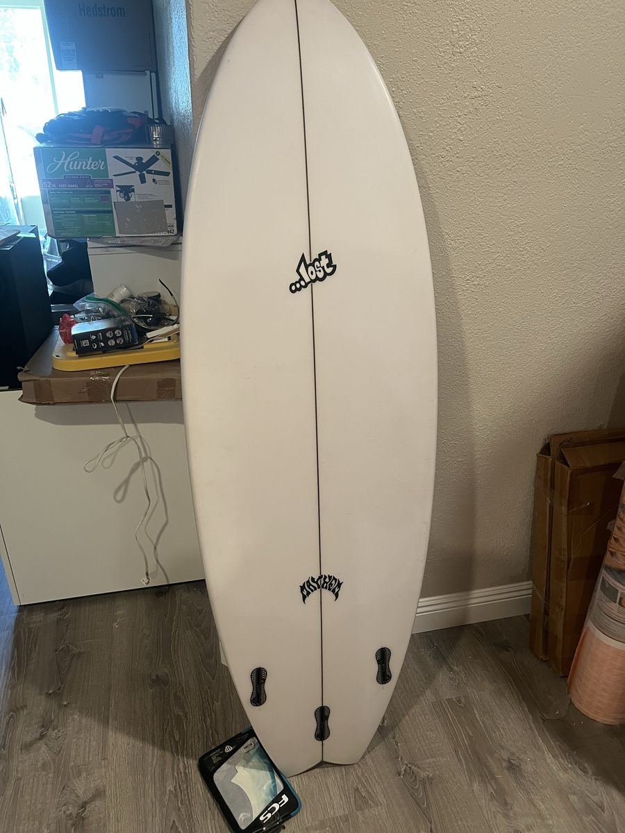 Mayhem surfboard 66 inches long. Brand new with fins.