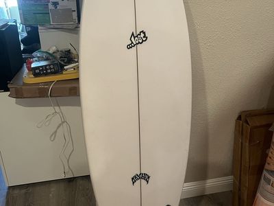 Mayhem surfboard 66 inches long. Brand new with fins.