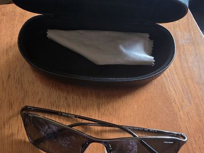 POLO SPORT Metal frame sunglasses brand new, with hard leather case Originally $200 Now only $50 negotiable