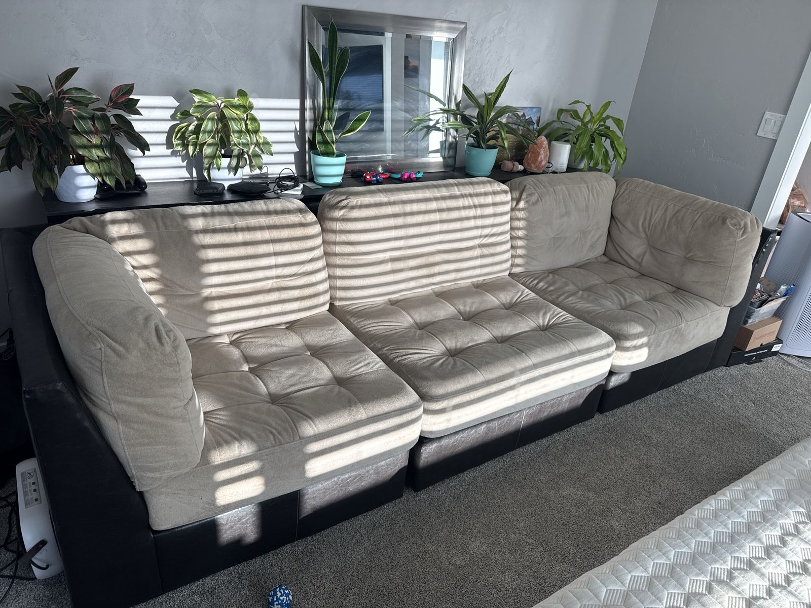 Large Beige Tufted Fabric Sofa with Dark Base