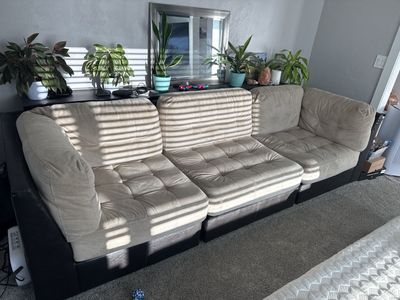 Large Beige Tufted Fabric Sofa with Dark Base