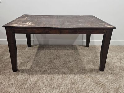Solid wood dining table with 4 chairs for sale.