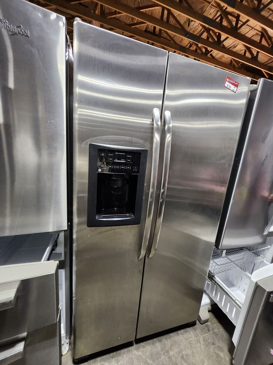 NICE GE STAINLESS STEEL SIDE BY SIDE FRIDGE! WITH A FULL WARRANTY