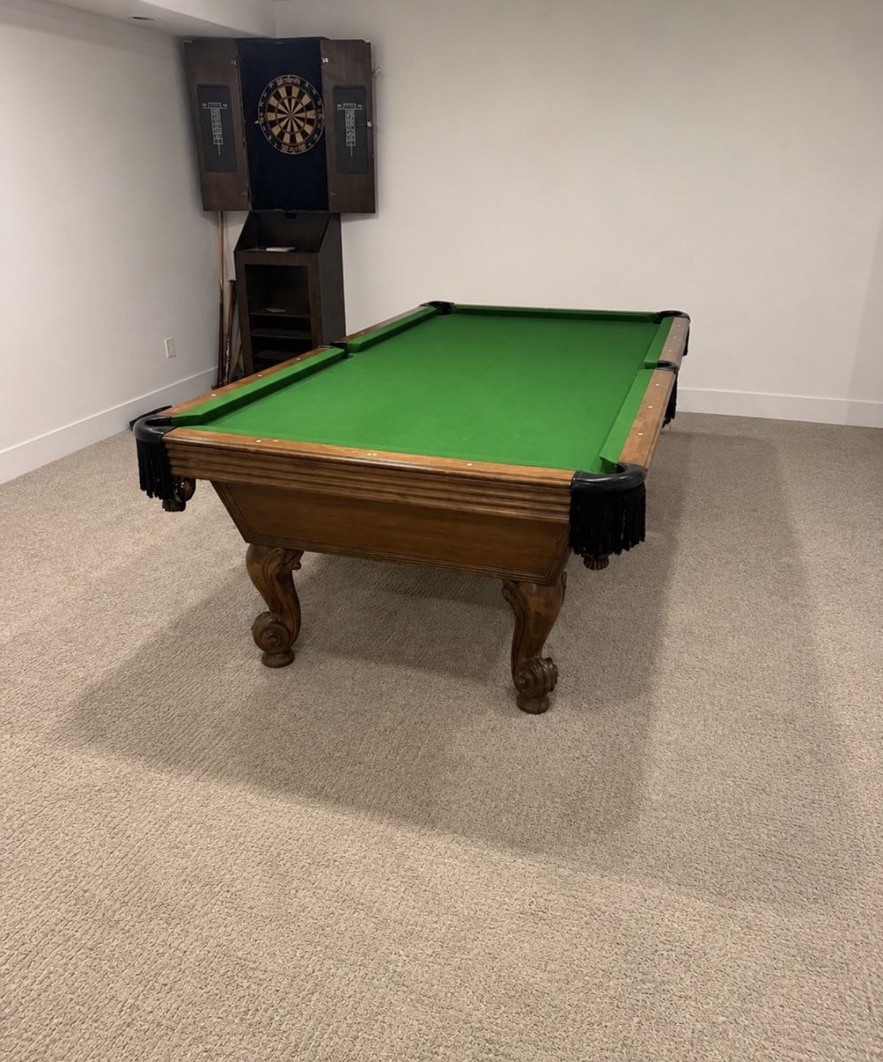 Traditional Wooden Pool Table with Green Felt and Fringe Pockets