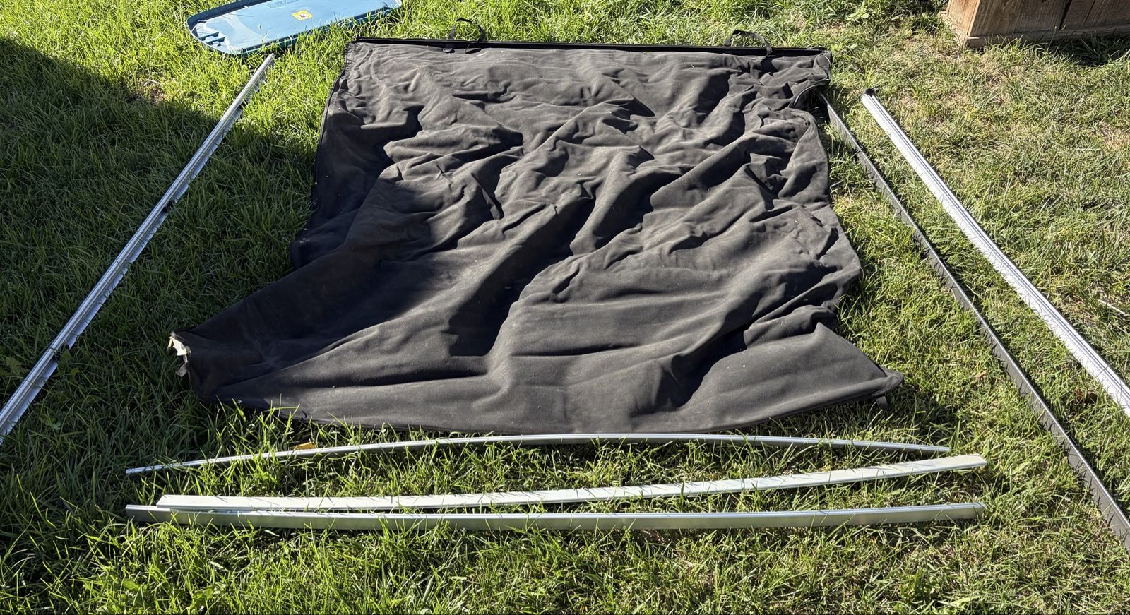Black soft tonneau truck bed cover with rails