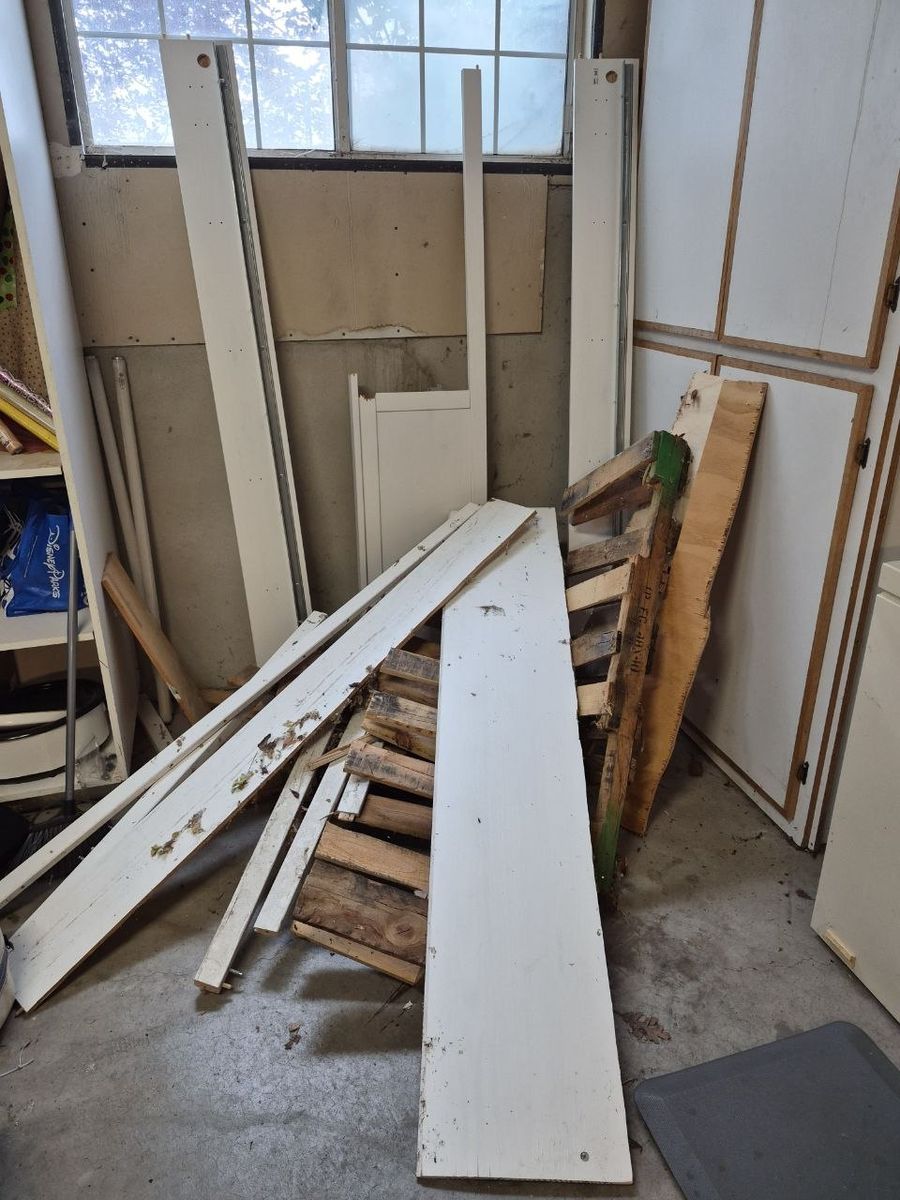 Scrap wood and some dried wood for carving, kindling, or firewood.