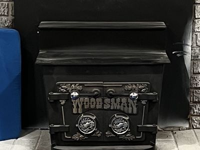 Woodsman Fire burning stove