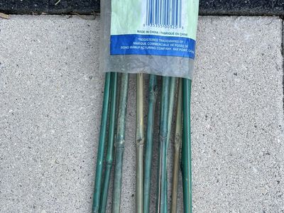 Set of green 11 bamboo stakes and weed digger.