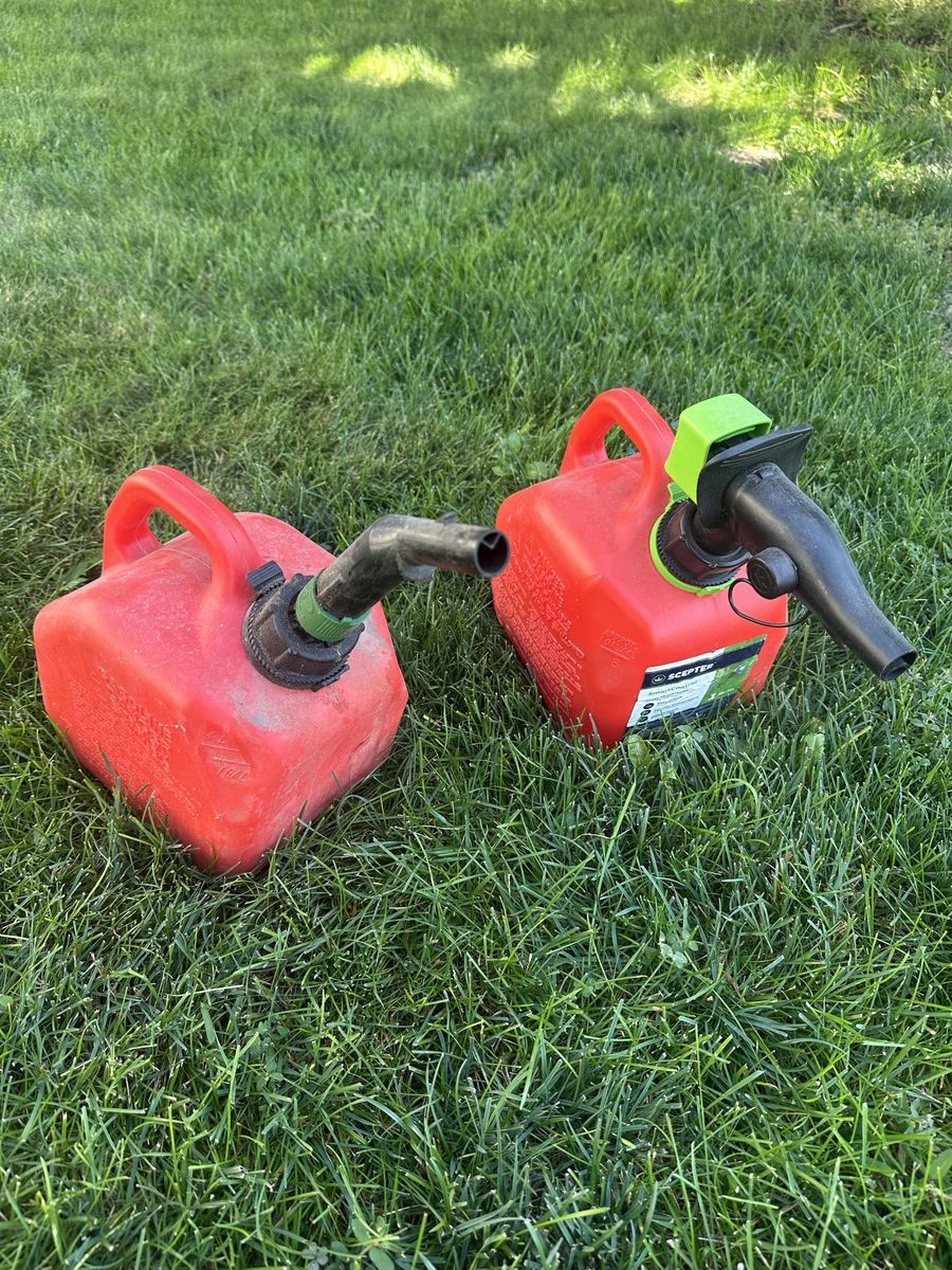 Set of 2 Used Red Plastic Gas Cans with Spouts