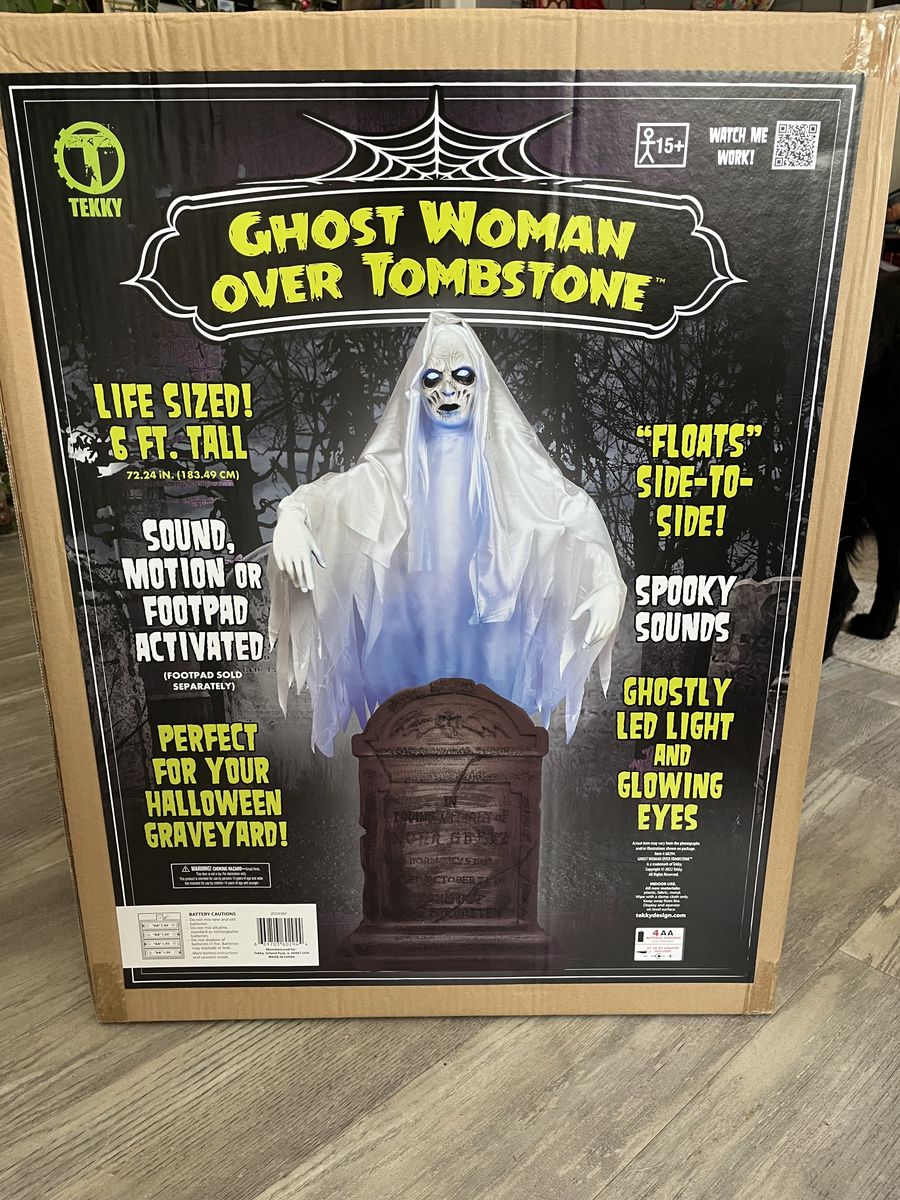 Ghost over tombstone animatronic