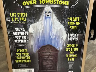 Ghost over tombstone animatronic