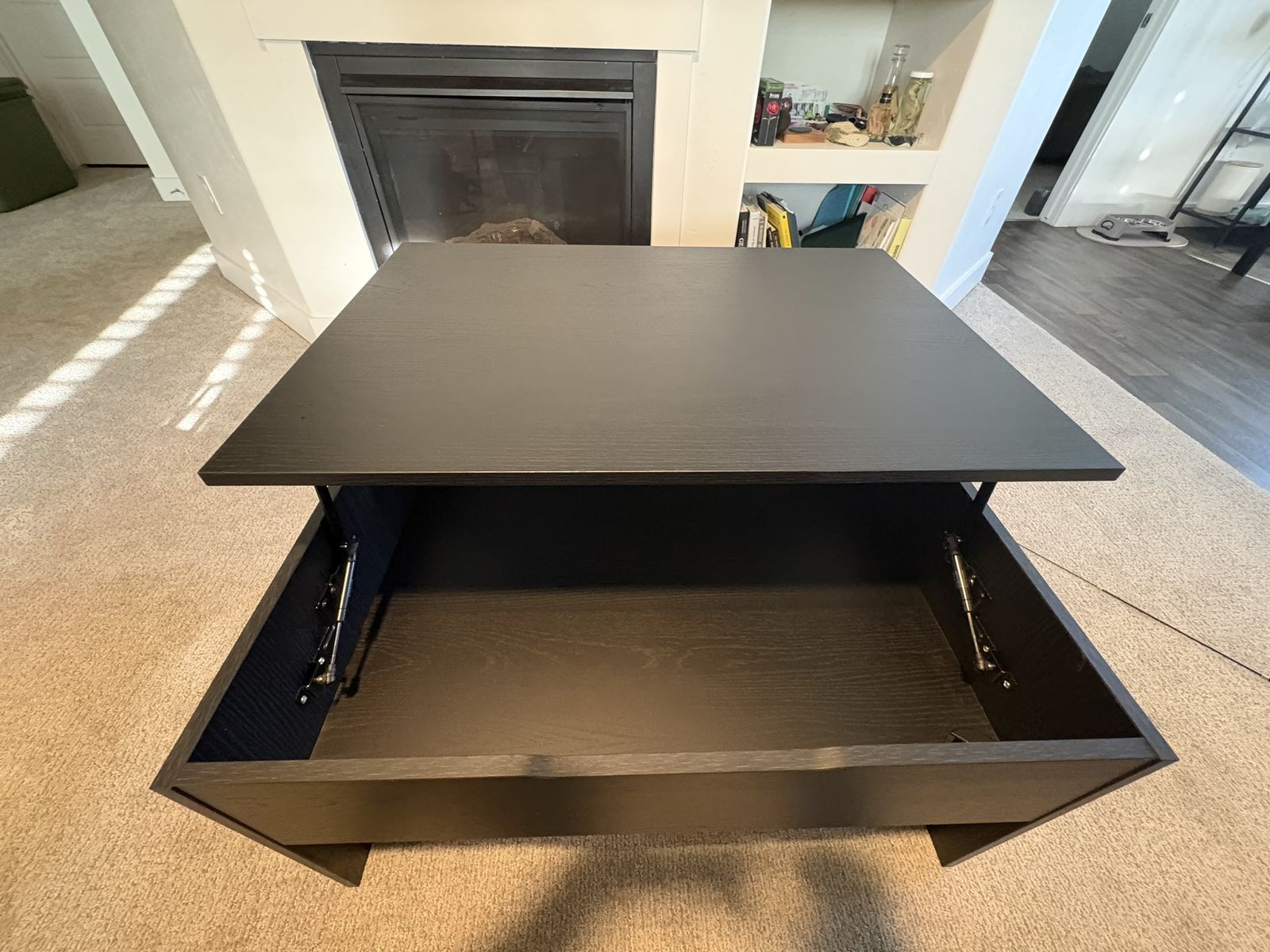 Black Ikea coffee table with opening top