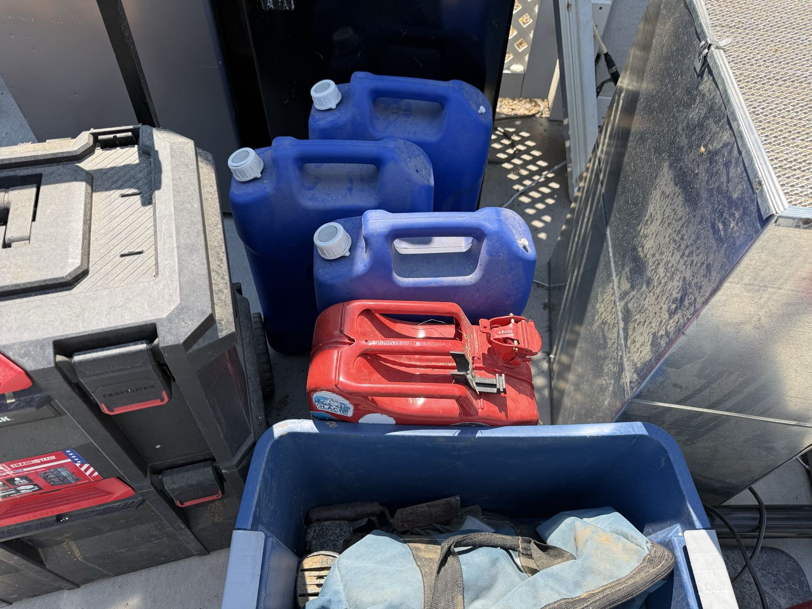 Fuel and Water Containers - Red Gas Can & Blue Water Jugs
