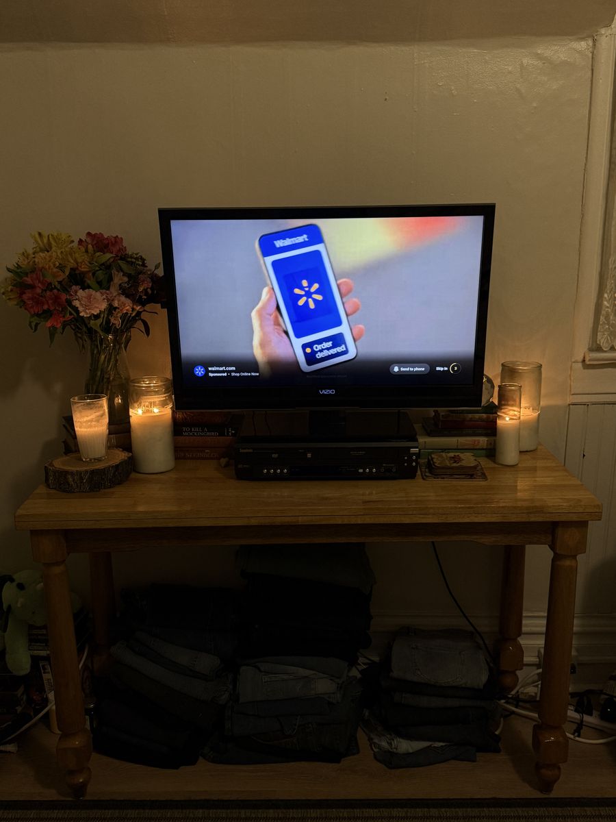 Solid wooden table with TV and fire stick.
