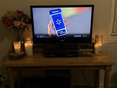 Solid wooden table with TV and fire stick.