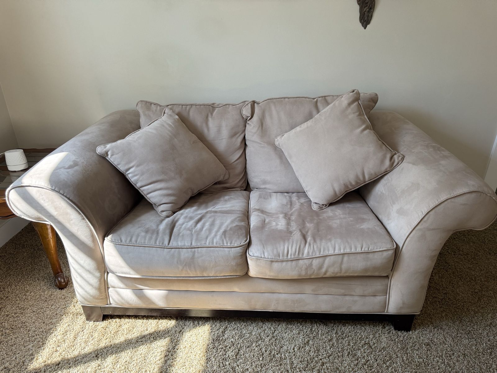 Beige Microfiber Loveseat with Rolled Arms and Matching Pillows