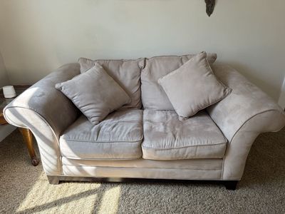 Beige Microfiber Loveseat with Rolled Arms and Matching Pillows
