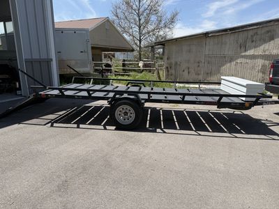 Single axle trailer with attached tool box