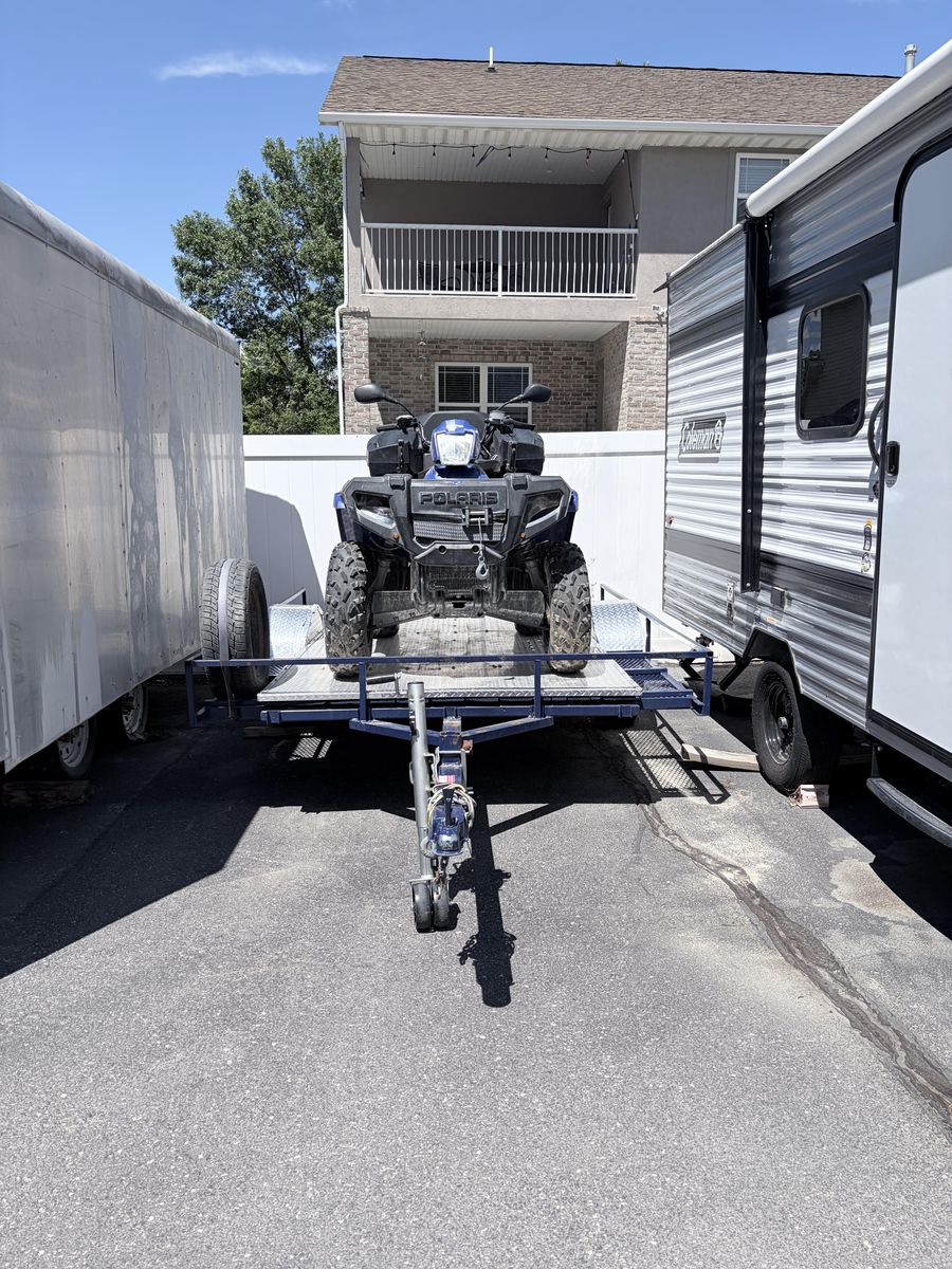 Polaris Sportsman 500, and single axle trailer.