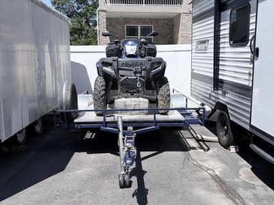 Polaris Sportsman 500, and single axle trailer.