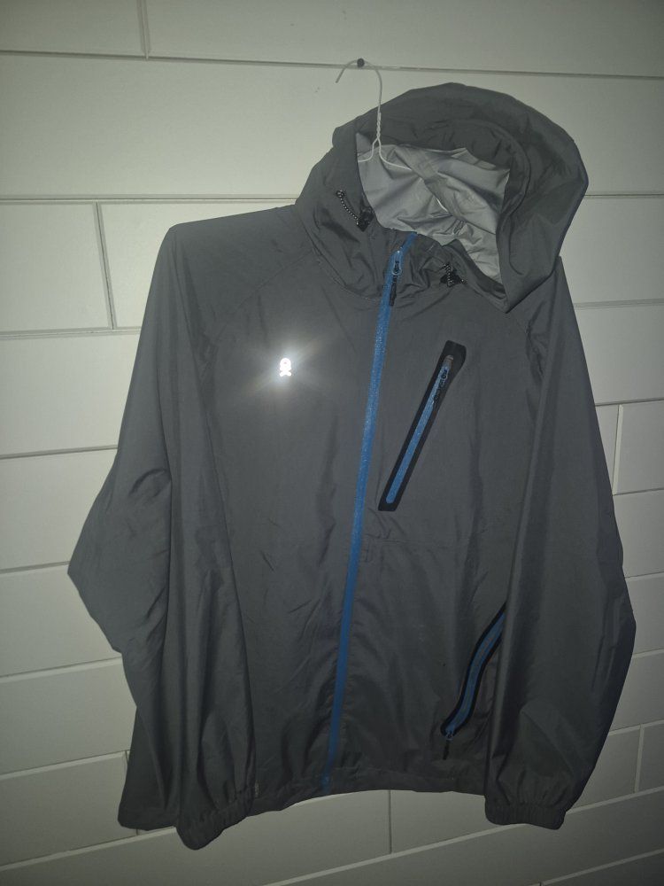 Little Andy Donkey
Unisex Gray Rain Jacket - Medium, Nylon, Reflective Logo, Blue Zippers
