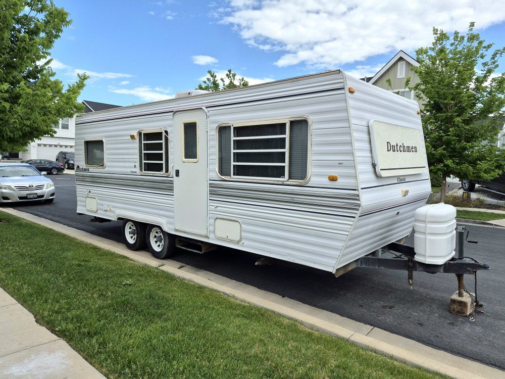 Dutchmen Sport Travel Trailer (Year Unknown) - Compact RV with Kitchen, Bathroom & Sleeping Area