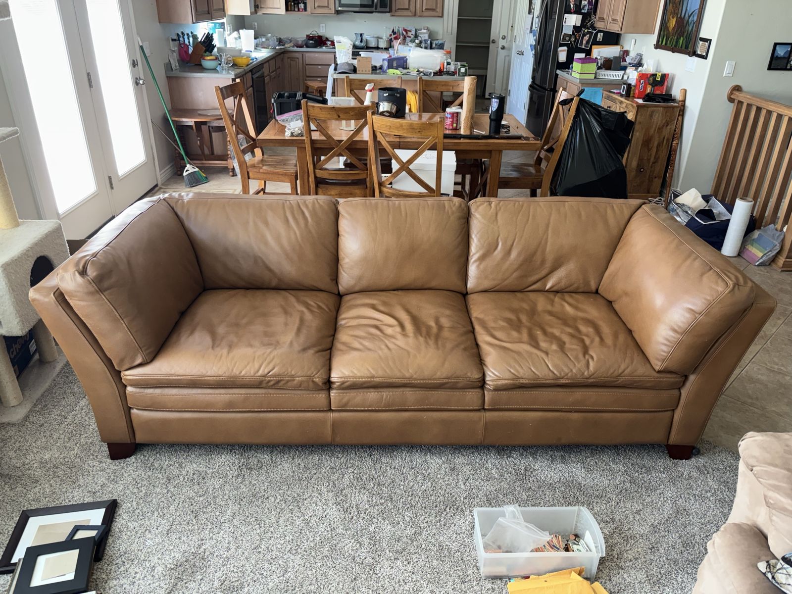 2 beautiful leather couches and ottoman