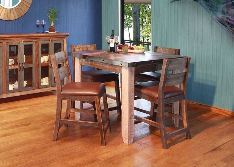 Multicolored pine dining table and 4 chairs as sold by RC Willey